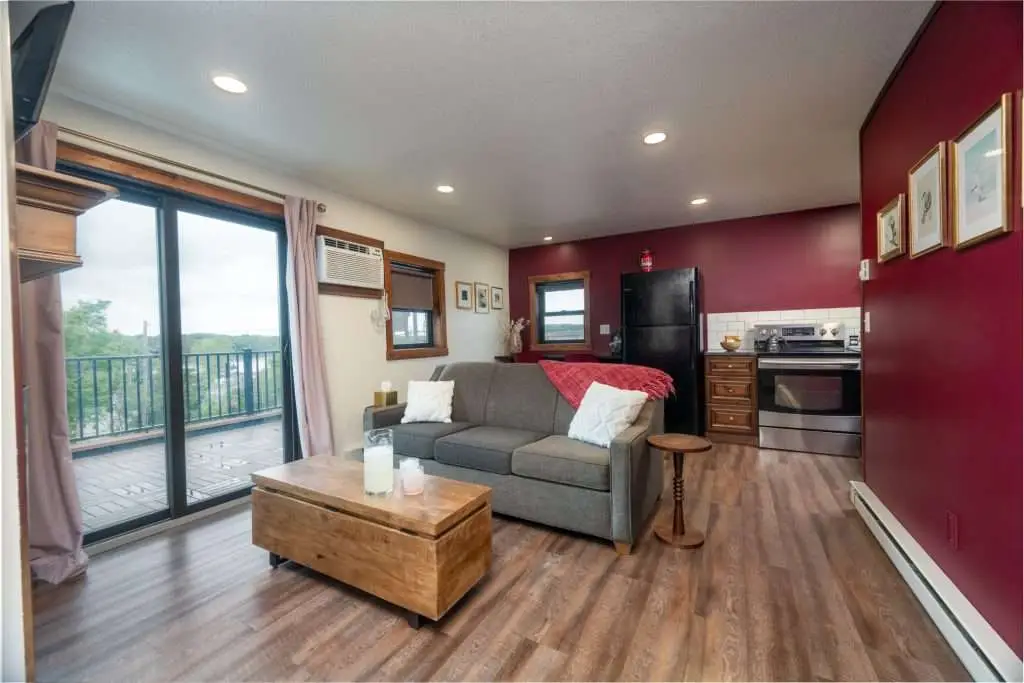 Living room with sofa and sliding door to the deck