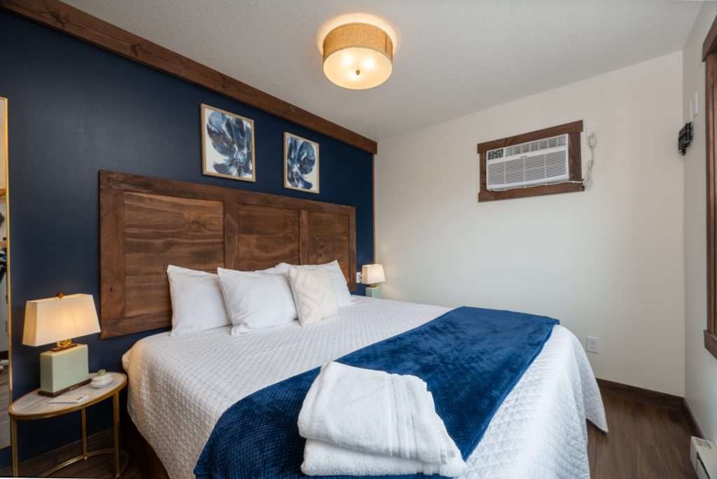 King bedroom with navy accent wall
