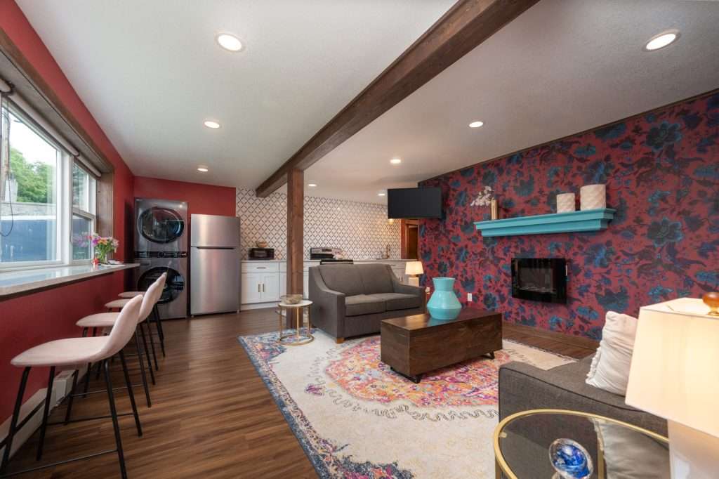 Living room with fireplace, sofa and counter seating