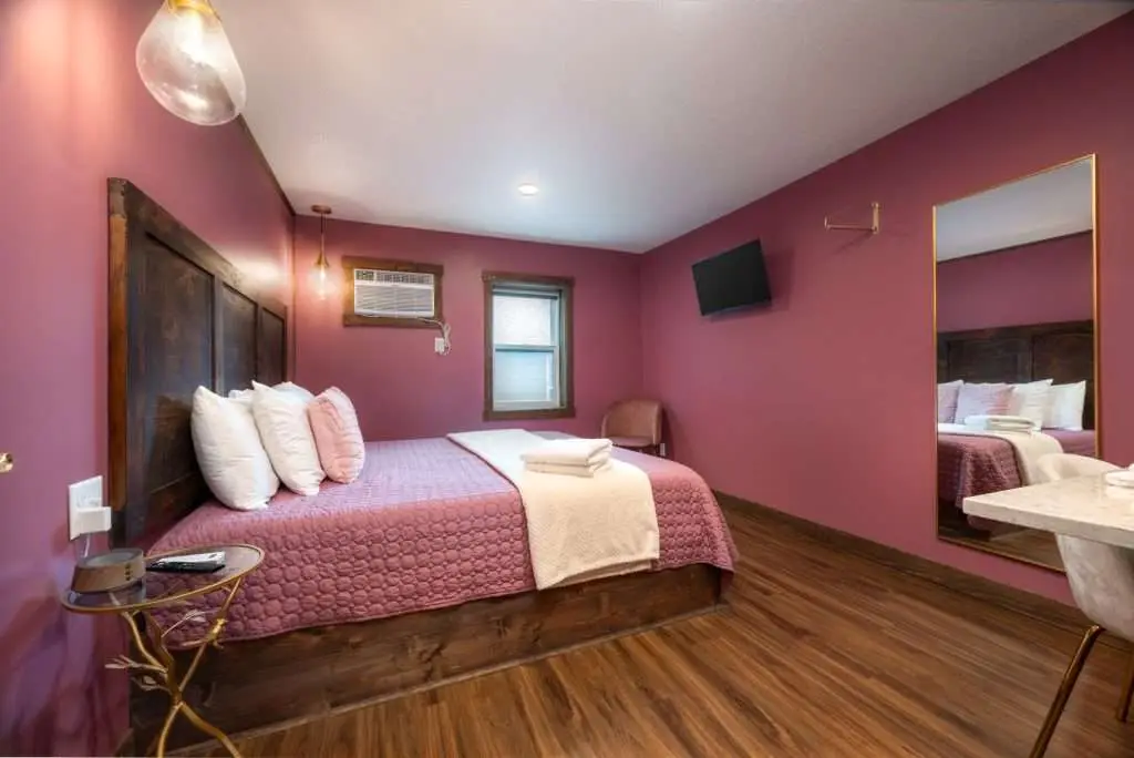 King bedroom with rose bedding