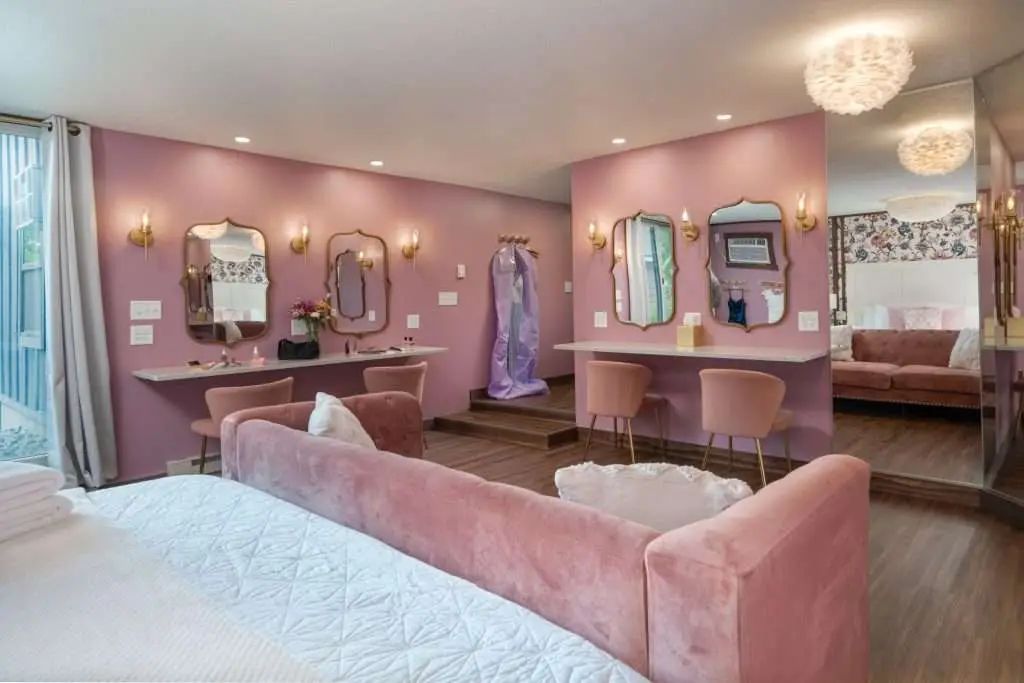 Glam room with four lighted hair and makeup stations