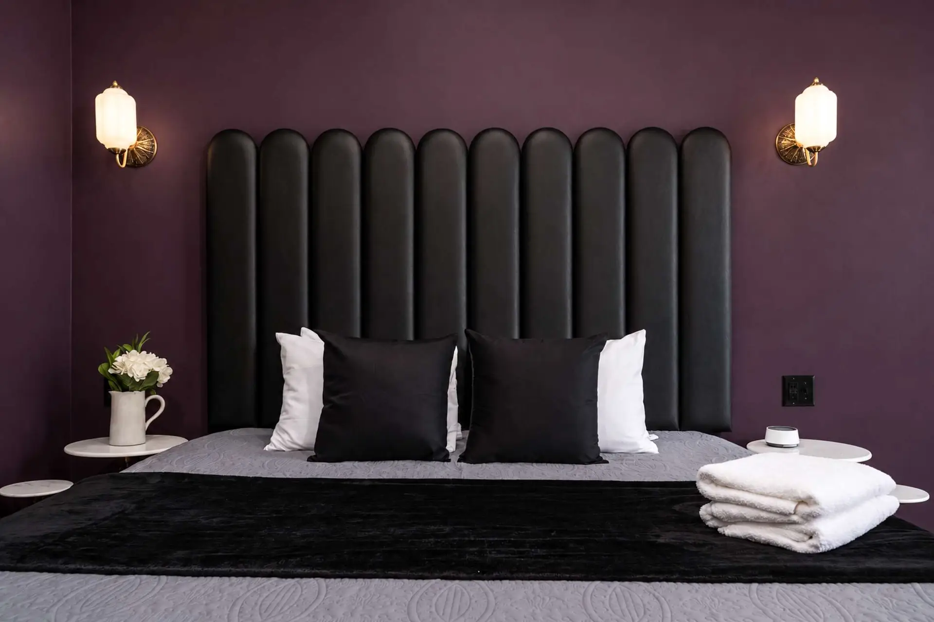 Plum, color-drenched suite at The Port After Dark
