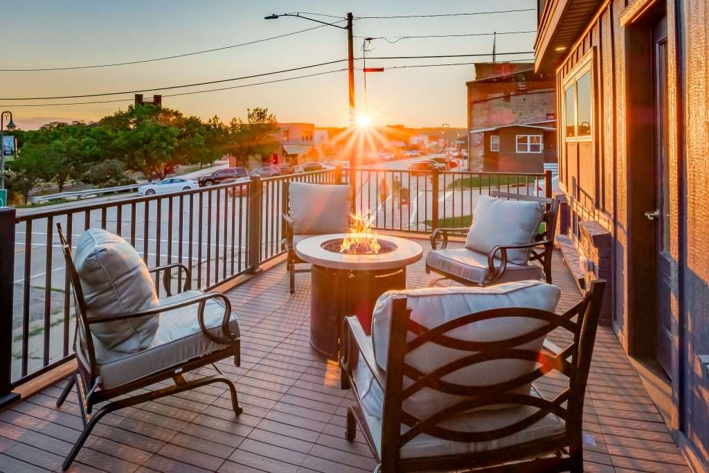 Private balcony with fire table at sunset